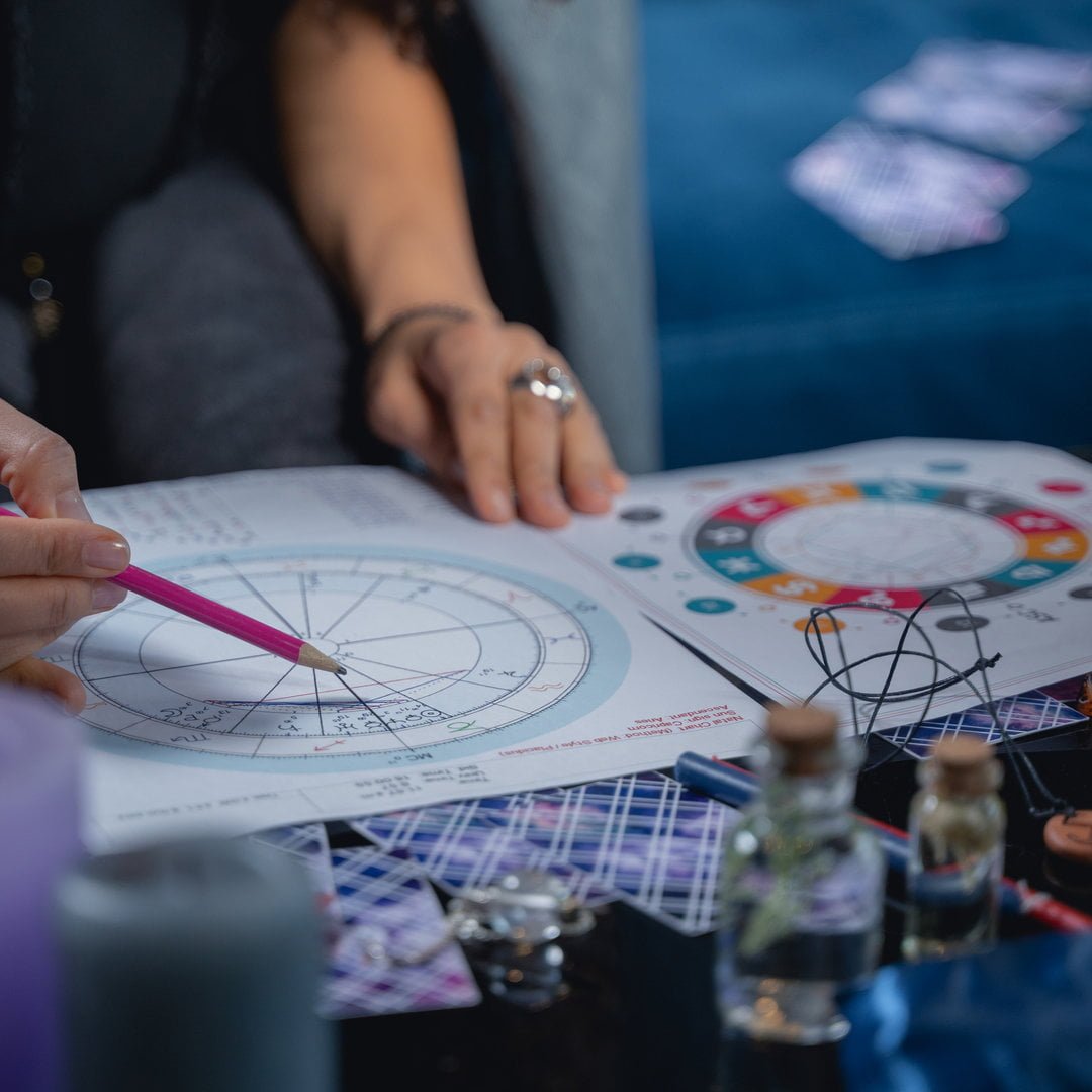Female astrologer calculating her clients rising sign
